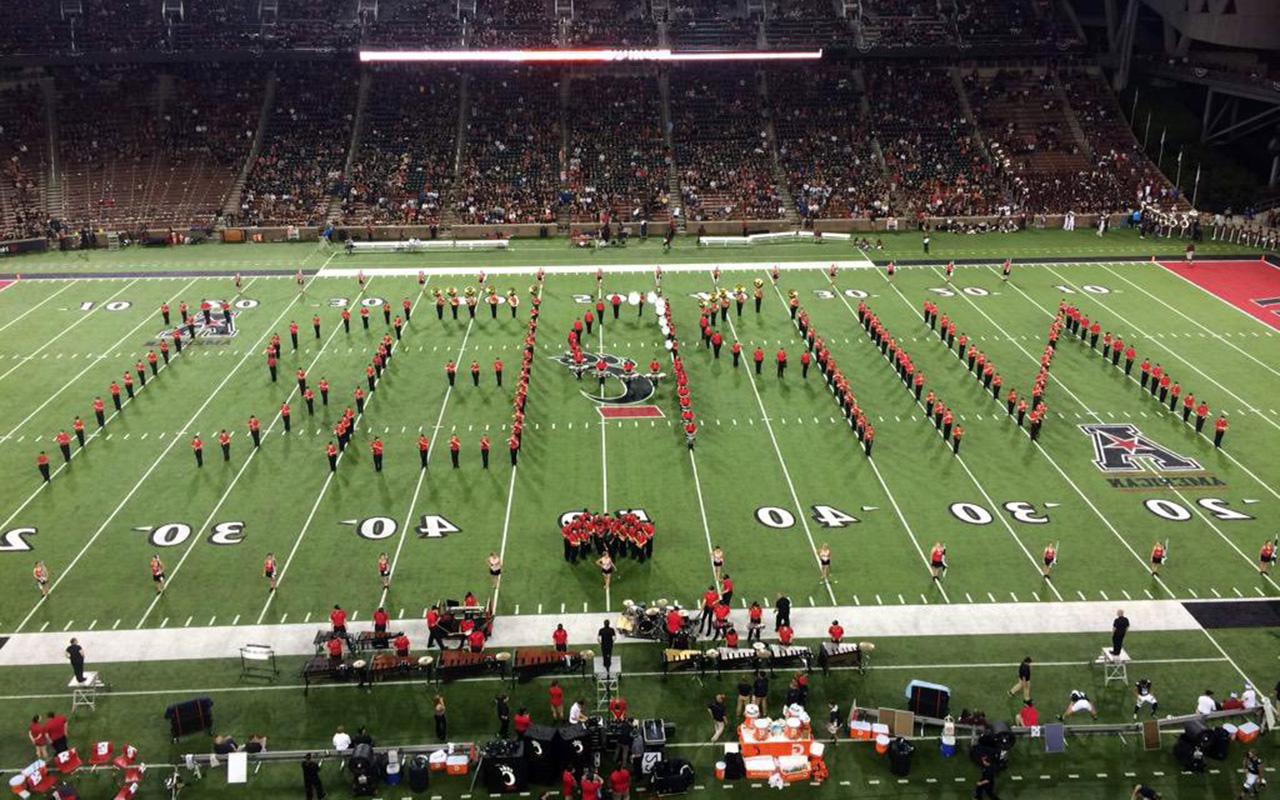 Nippert Stadium field with the band spelling out the word Nippert